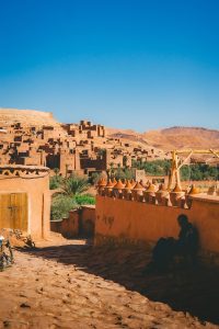 Traditional mud brick village in a desert landscape.